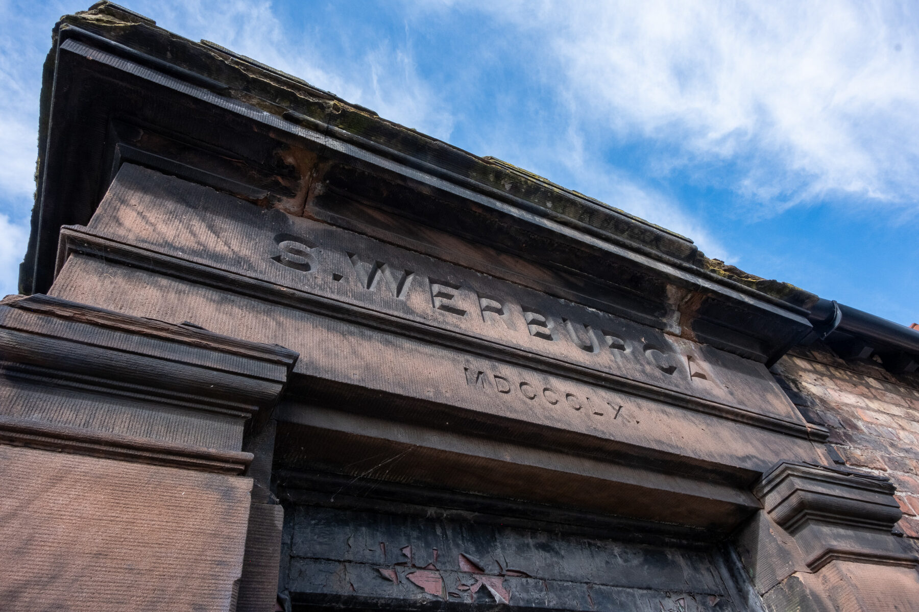 Carved stone pediment of St Werburgh