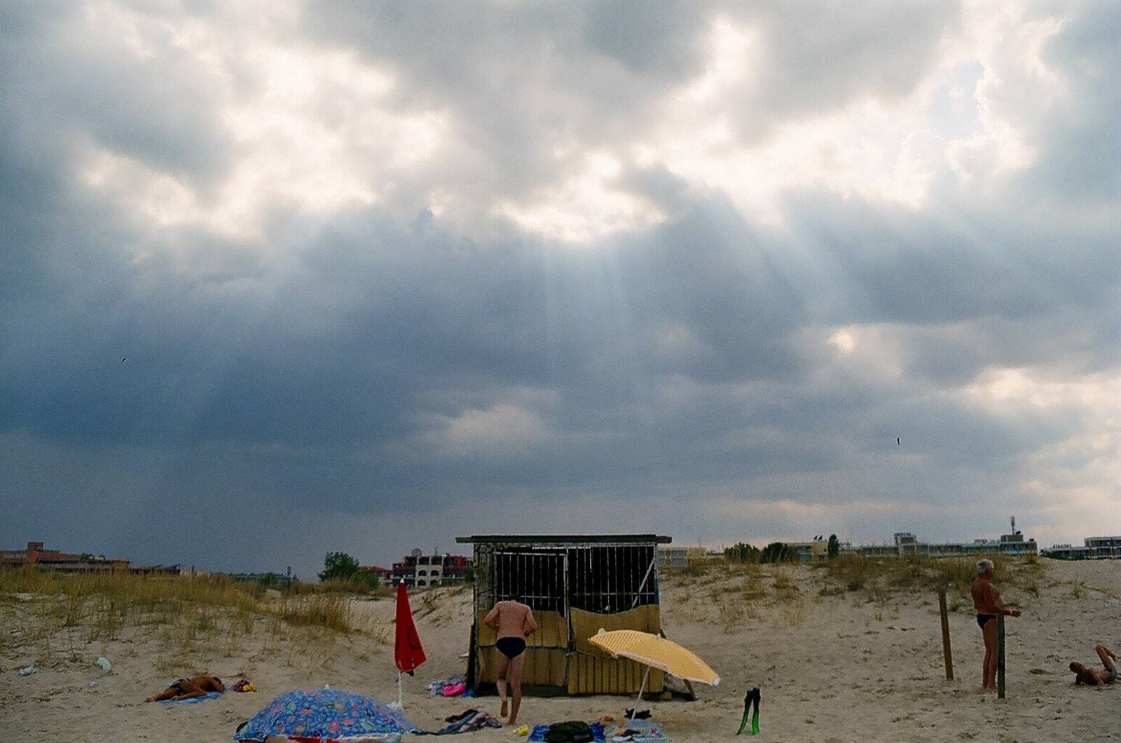 Beach hut under storm clouds
