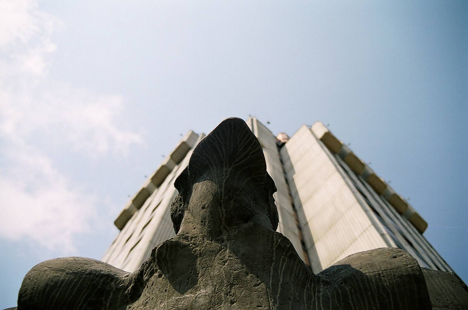 The profile: a filing cabinet for the future, cantilevered against the sky.