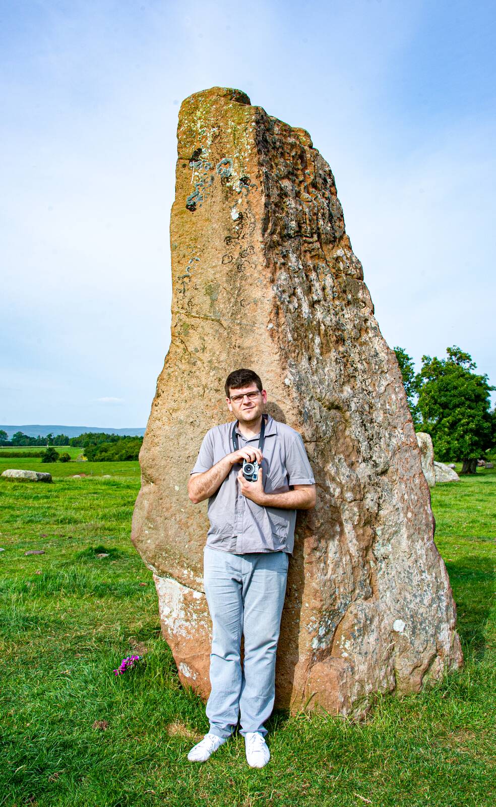 A young visitor standing at Long Meg