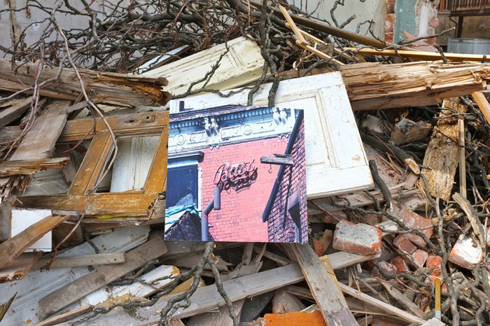 A print lying in demolition rubble