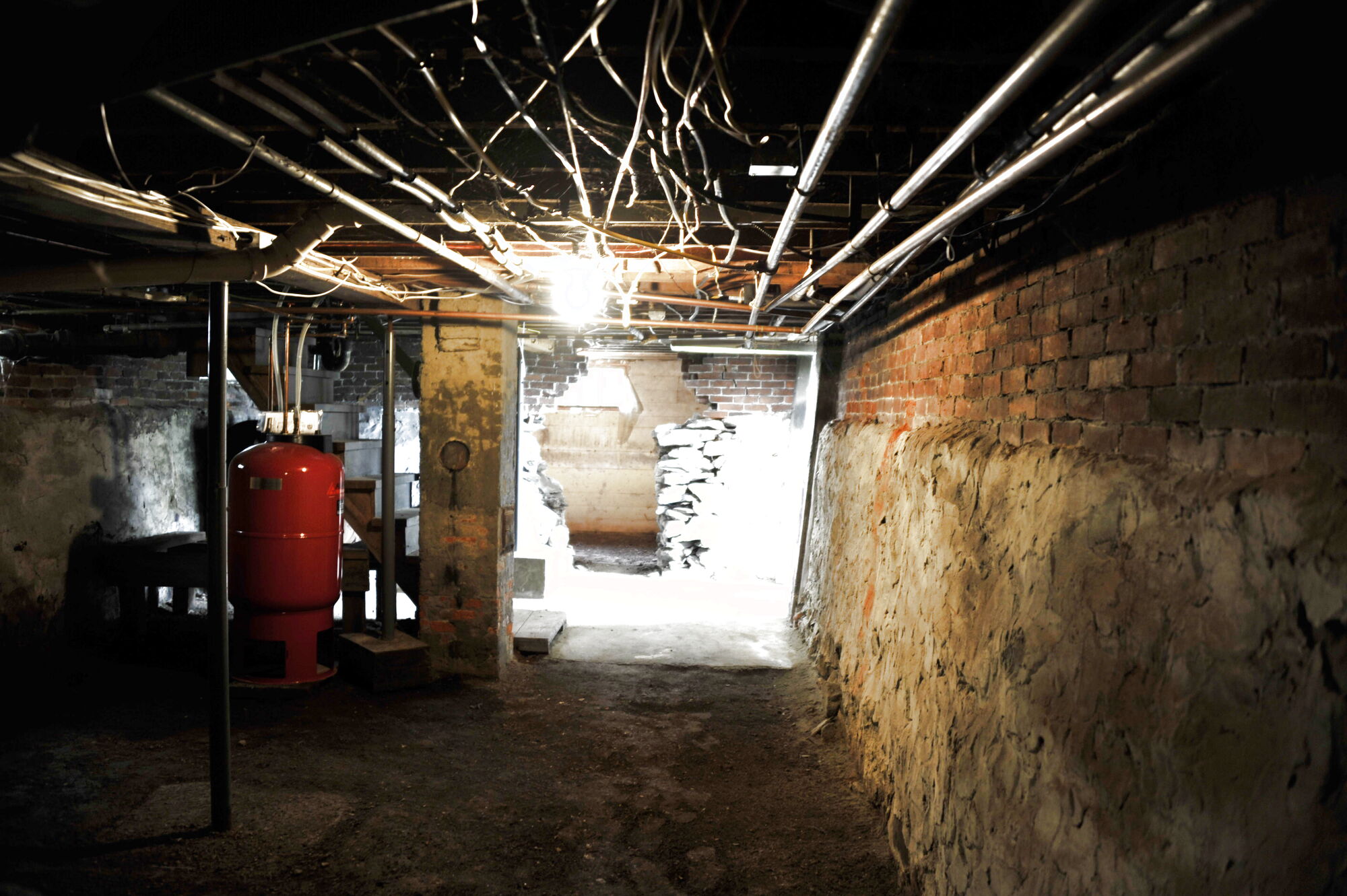 The red furnace in the granite cellar, lit from the hatch