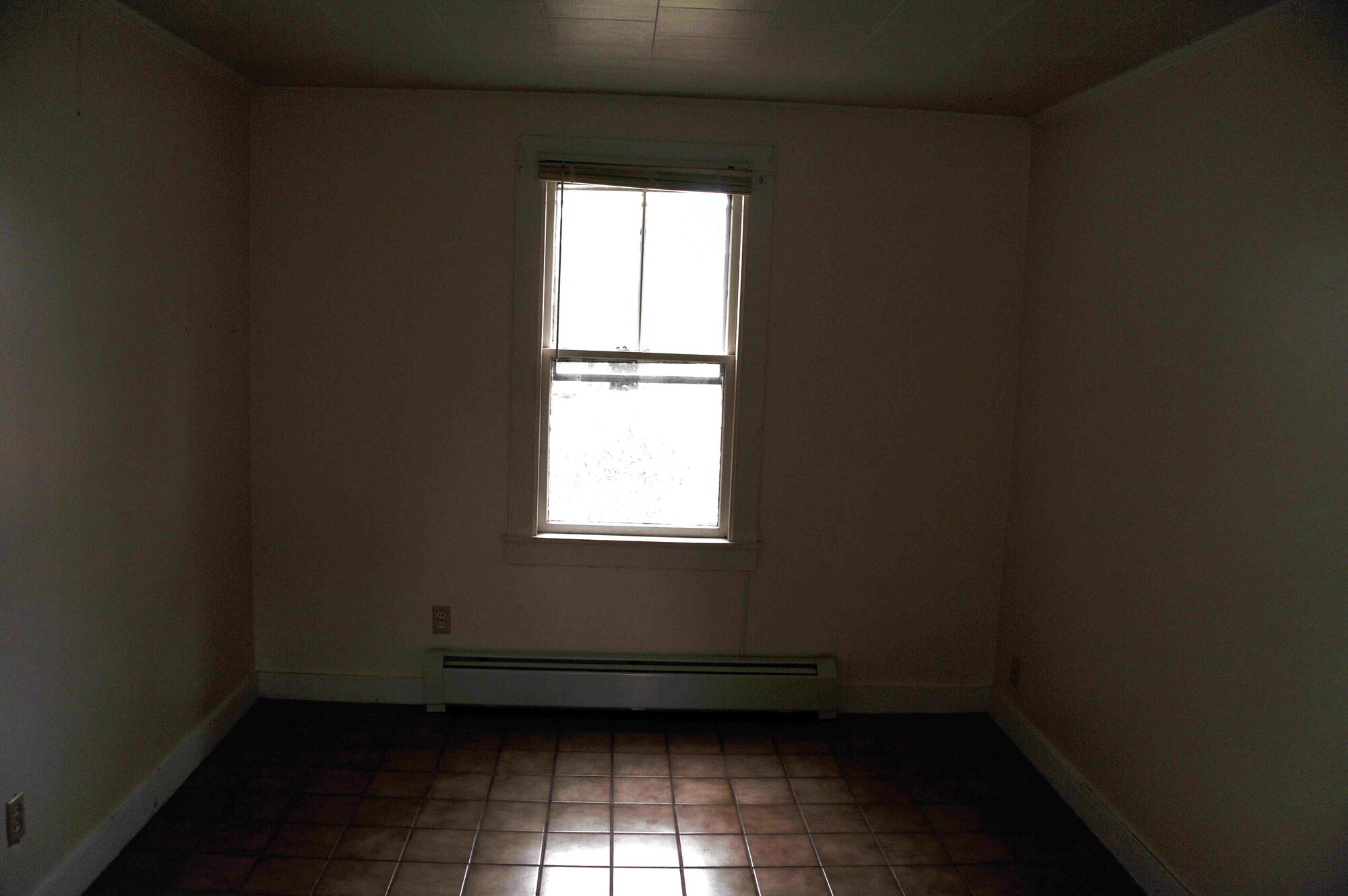 An empty room at dusk, warm and dim